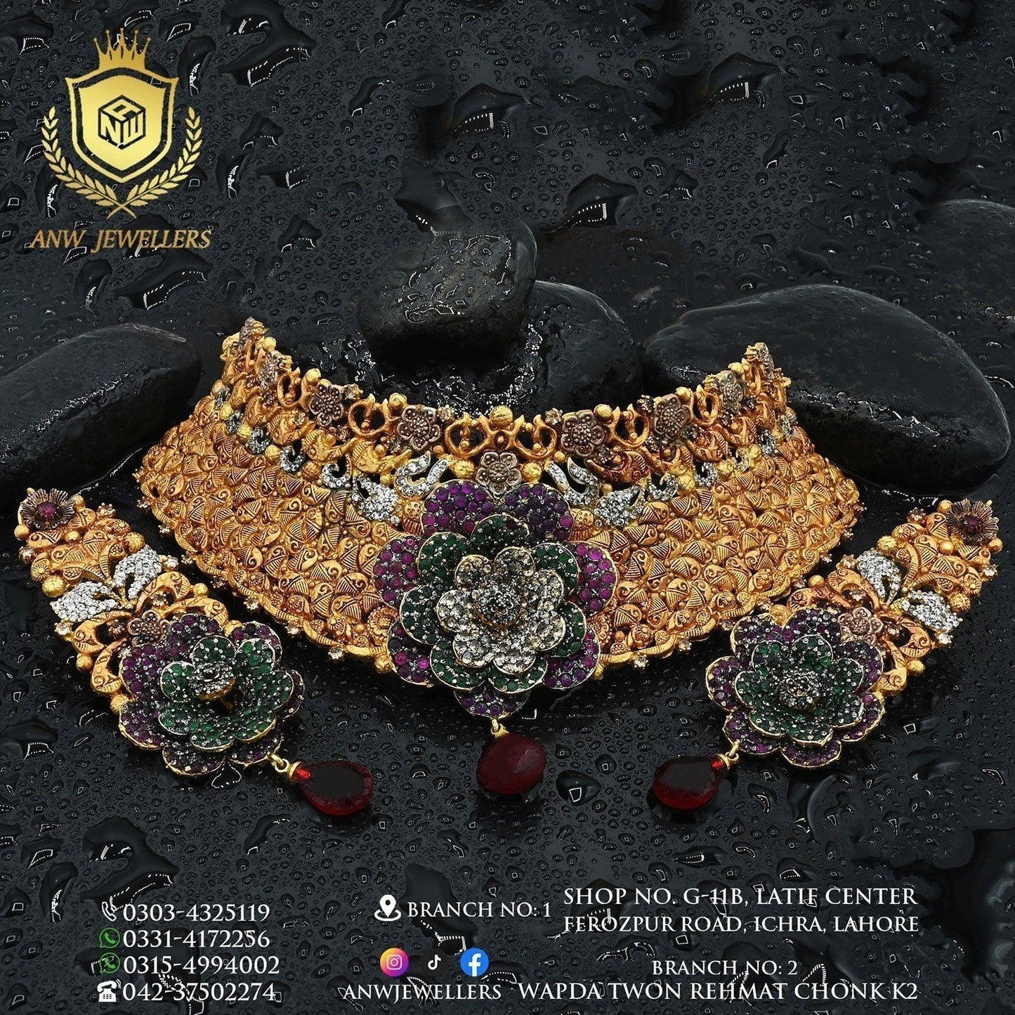 Gold bridal jewelry set with floral designs, gemstones, and intricate detailing on black stones