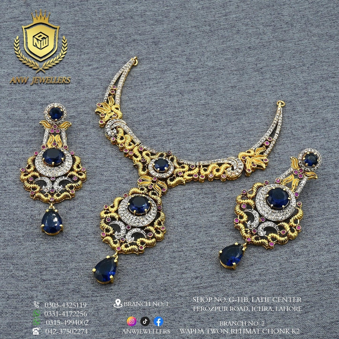 Gold bridal jewelry set with blue gemstones, intricate detailing, and matching earrings.