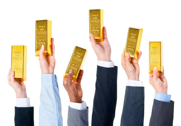 Businesspeople holding gold bars, investment concept on white background